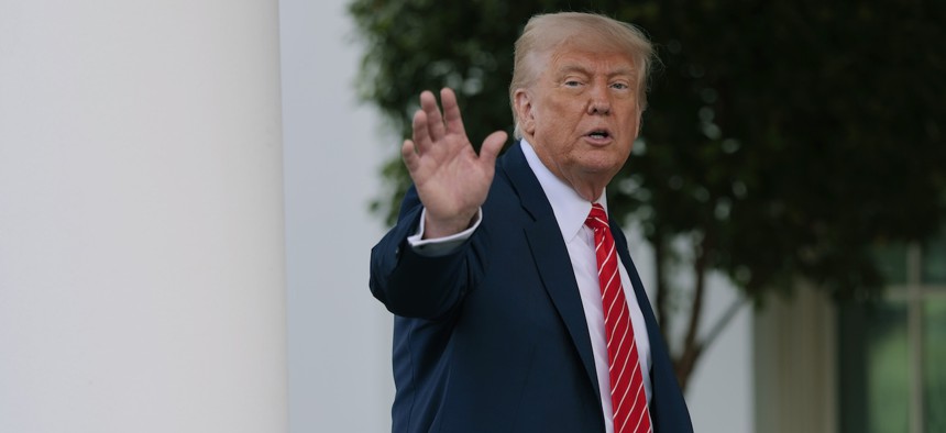 President Donald Trump speaks to reporters outside the West Wing of the White House on May 8, 2025.